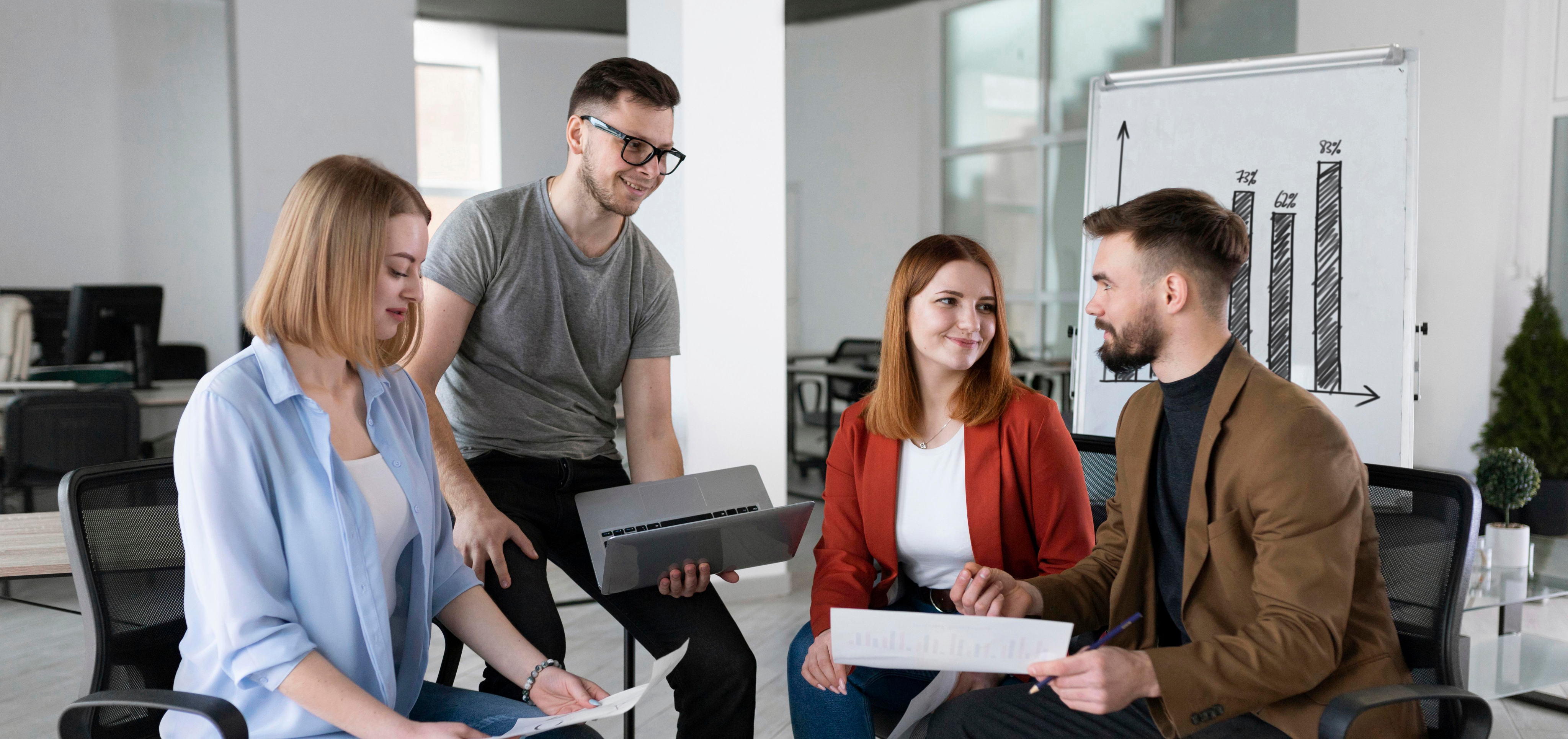 Coworkers collaborating in office